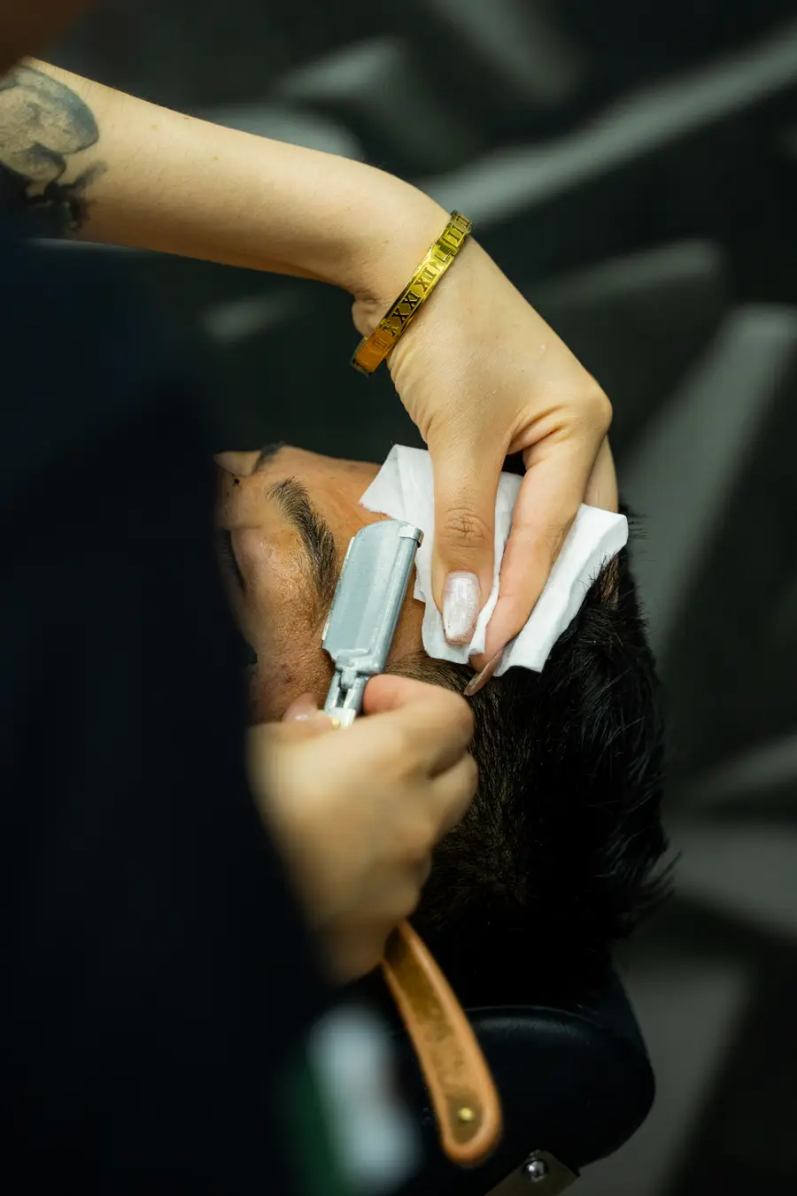 Straight razor shave on the cheek, close