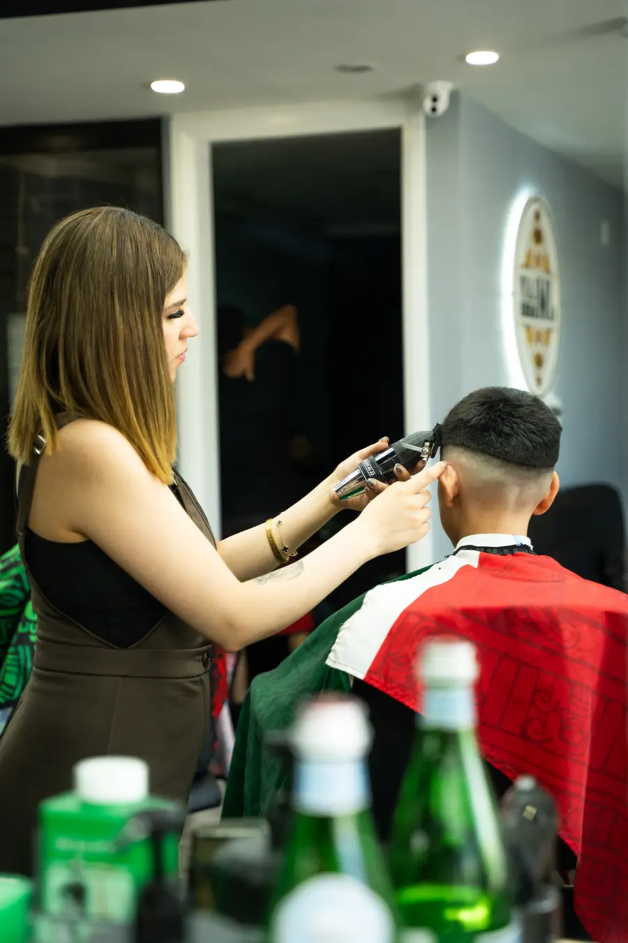 A kids cut in front of the mirror