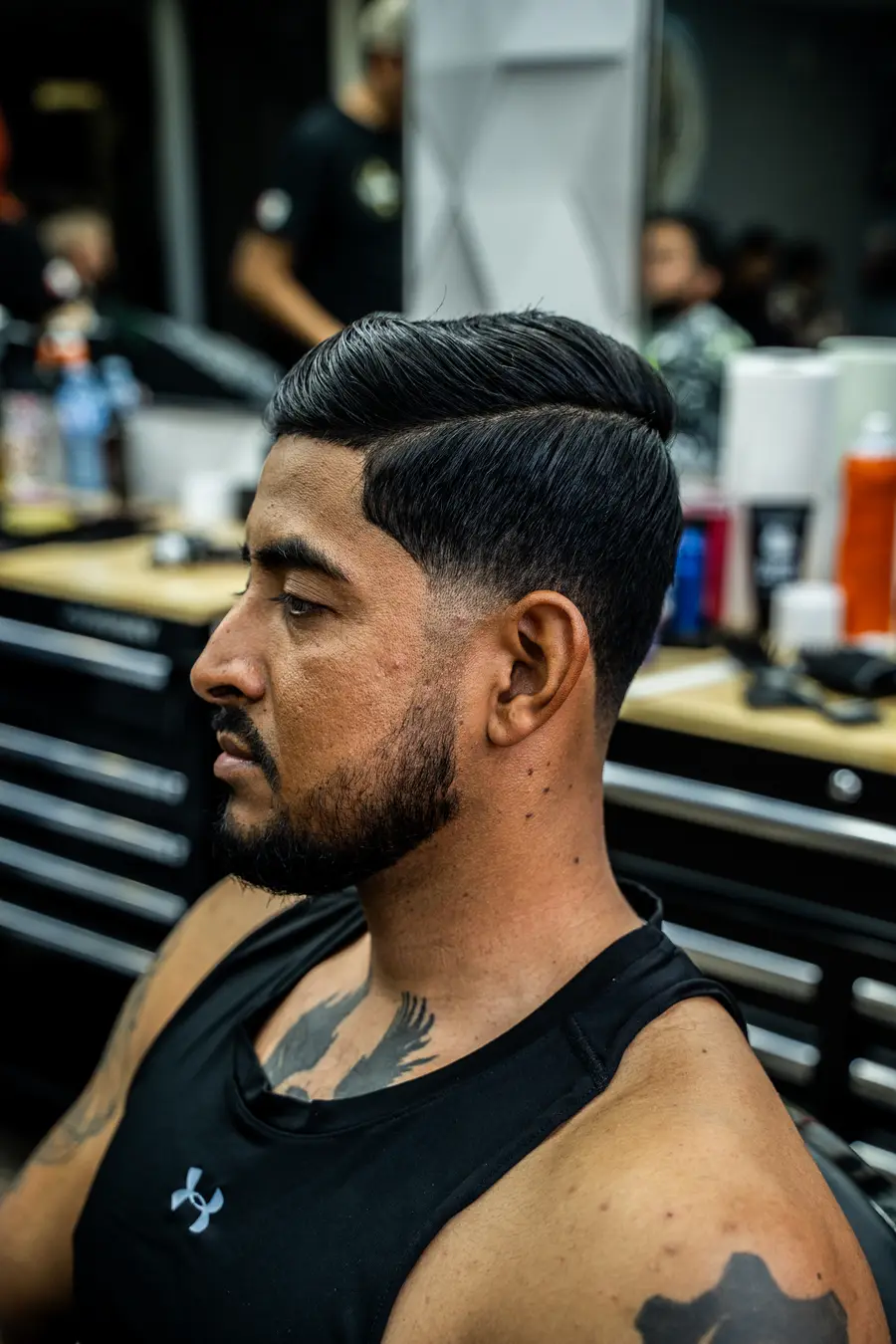 Finished side part with skin fade and beard line up, profile